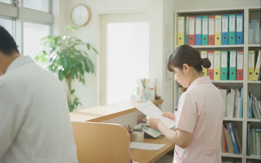 A clinic director reading a printed report